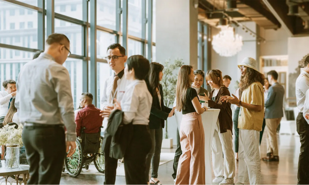 Photo of people socializing in the conference hall